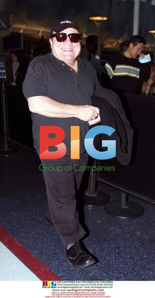 Danny DeVito departs LAX airport barefoot