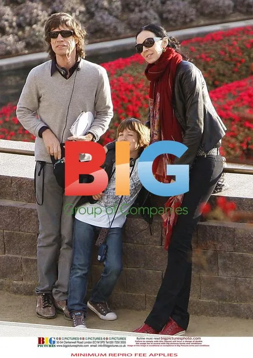 Mick Jagger poses with son and girlfriend