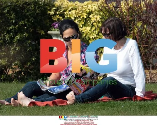 Jackiey Budden and friend read magazine about Jade Goody