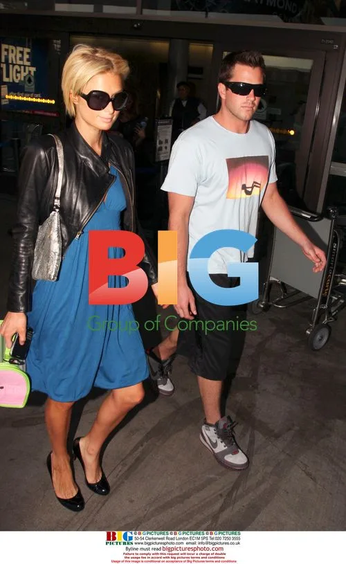 Paris Hilton and Doug Reinhardt arrive at LAX