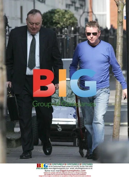 John Burns out with his dog in London
