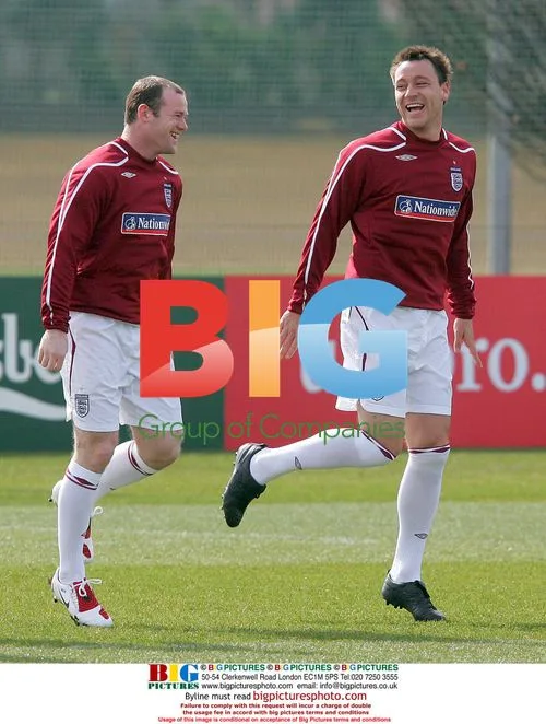 Wayne Rooney and John Terry laugh during England training