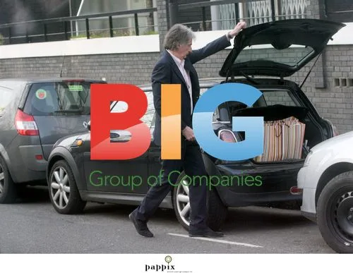 Paul Smith loads signature bags into car