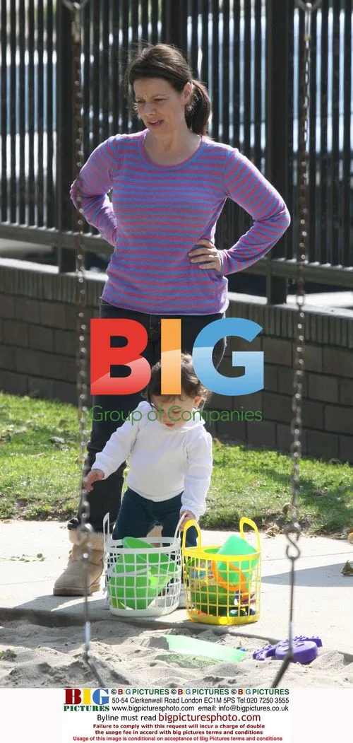 Justine Bateman and son playing in park