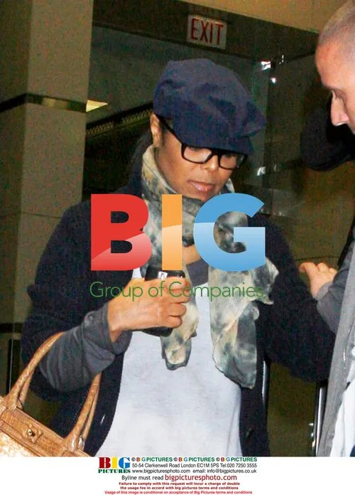 Janet Jackson with male friend at LAX