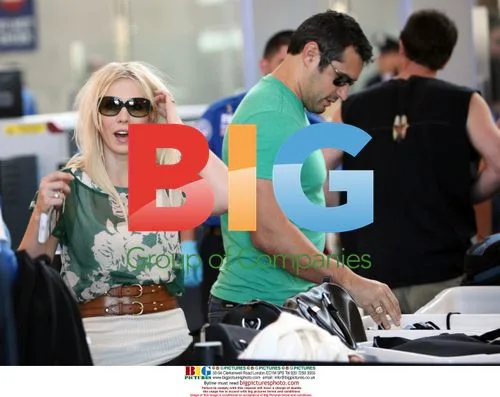 Newlyweds Natasha Bedingfield and Matthew Robinson depart LAX