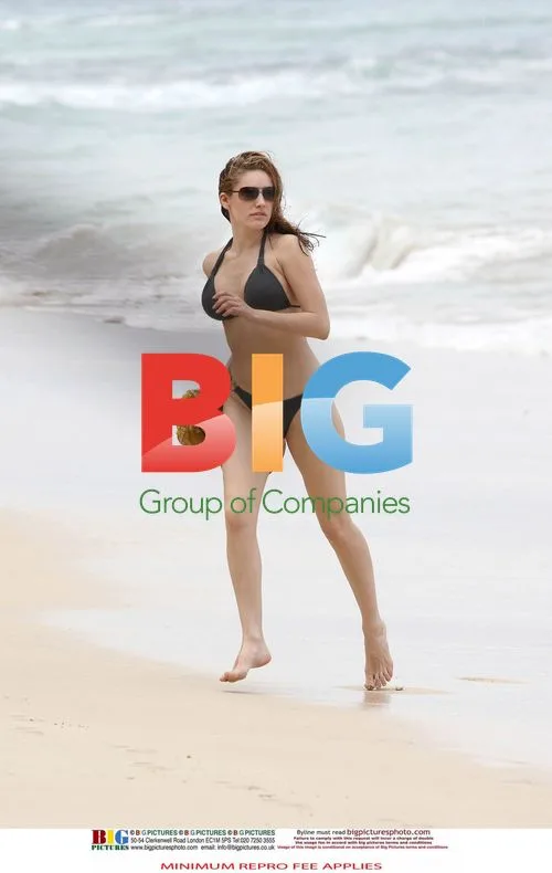 Kelly Brook in Black Bikini on Caribbean Holiday