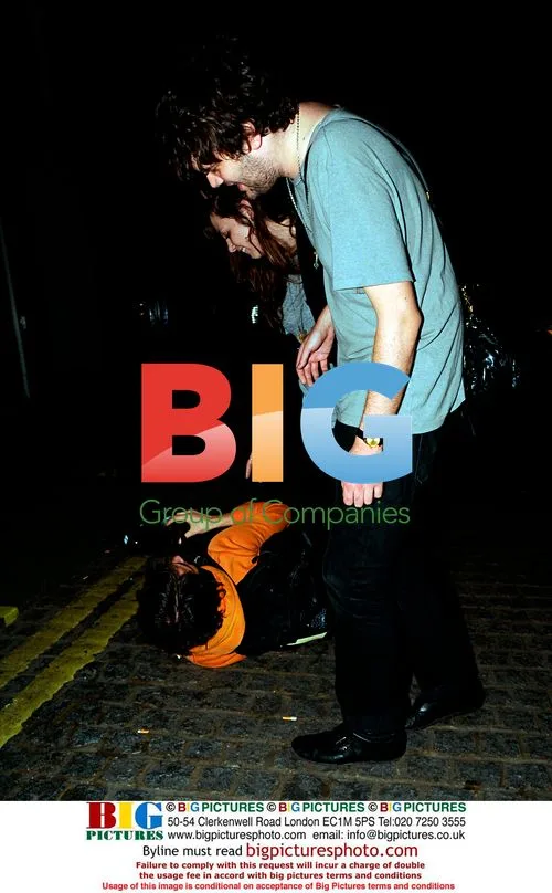 Klaxons' Jamie Reynolds laughs with photographer