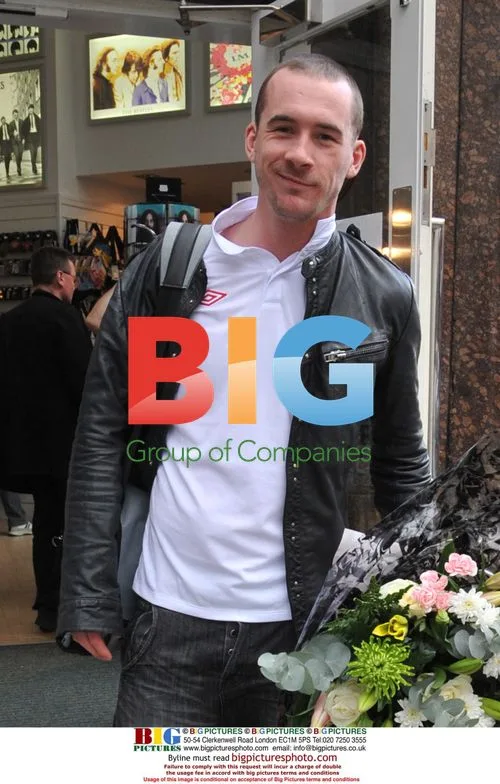Barry Sloane buys flowers in Liverpool