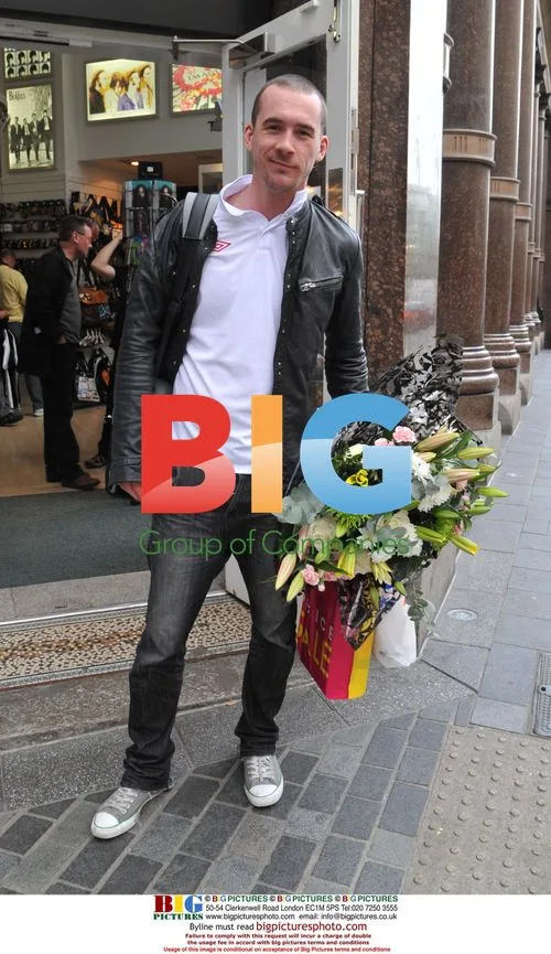 Barry Sloane buys flowers in Liverpool