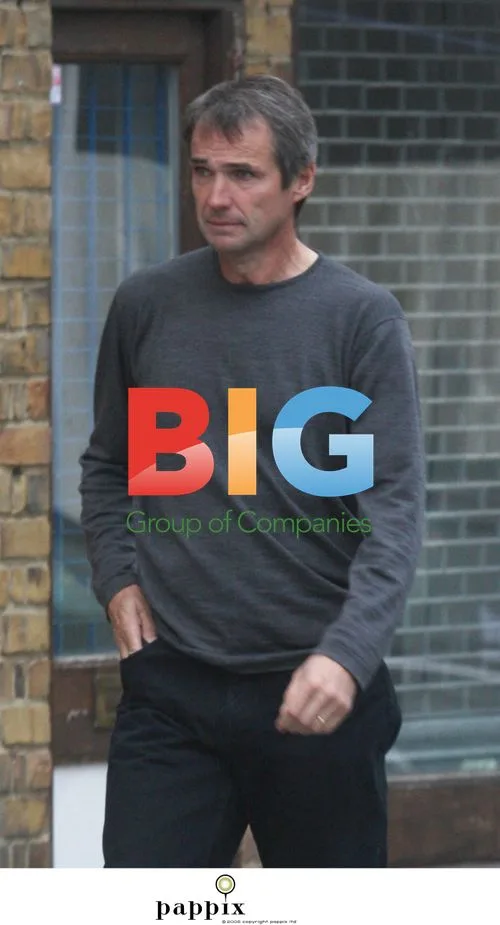 Alan Hansen Looking Somber in London