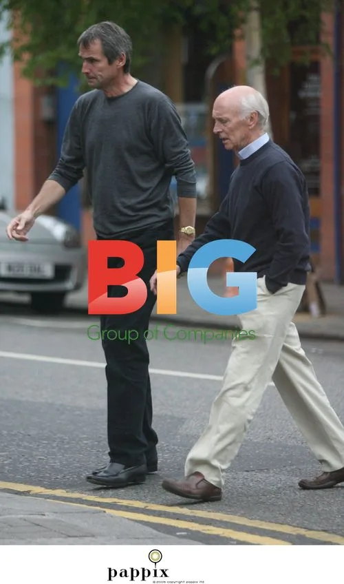 Alan Hansen Looking Somber in North London