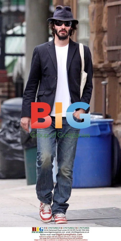 Keanu Reeves walks with two women in NYC