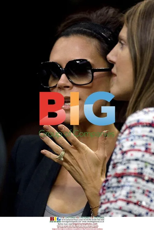 Victoria Beckham watches David get booking