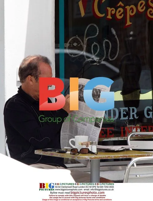 Michael Keaton Reading Newspaper