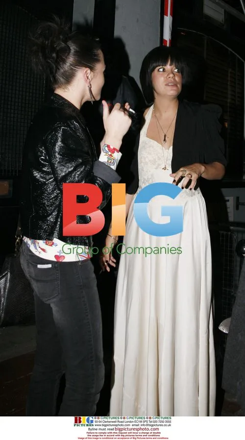 Lily Allen and Jaime Winston take a cigarette break