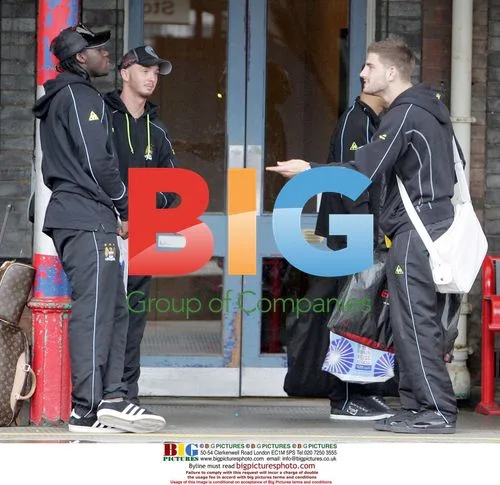 Manchester City players on train to Spurs match