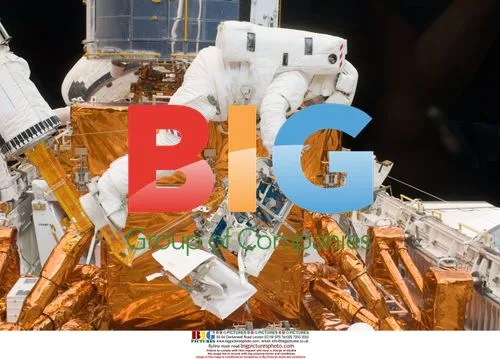 STS-125 Astronaut Michael Good works on Hubble