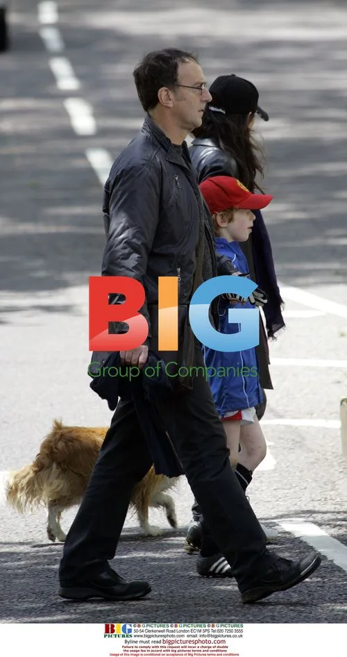 Angus Deayton walking dog in London