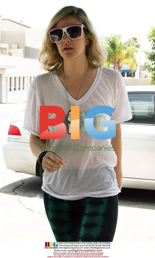 Drew Barrymore arrives at Hollywood studio in white top