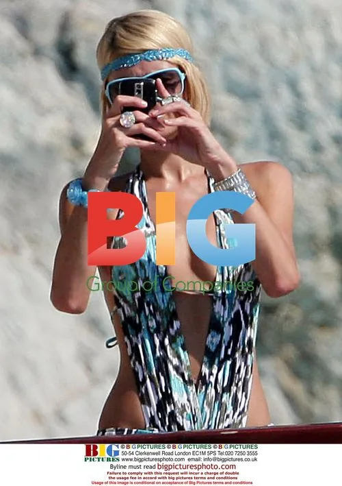 Paris Hilton in Eden Roc pool with boyfriend
