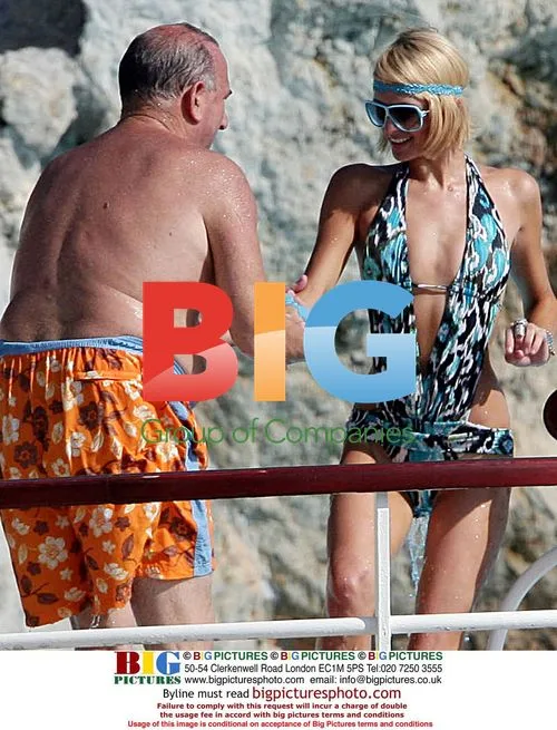 Paris Hilton with boyfriend at pool