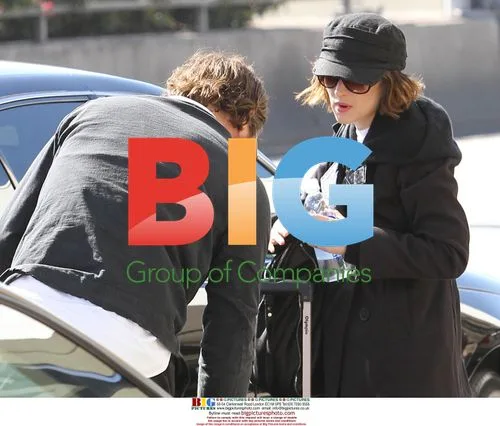 Winona Ryder with Mystery Man at LAX