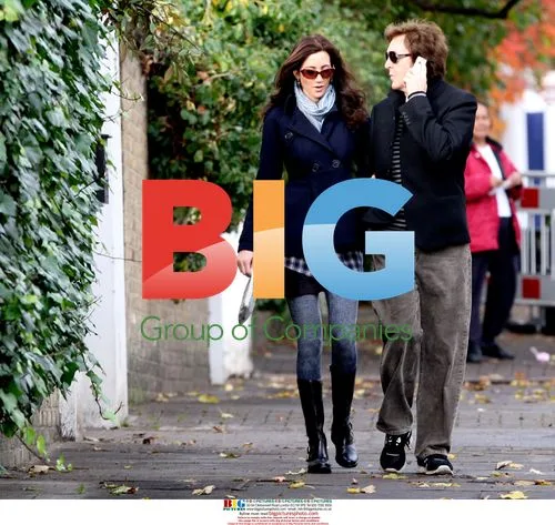Paul McCartney Strolls With Partner