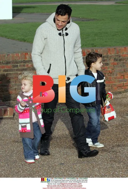 Peter Andre with kids feeding swans