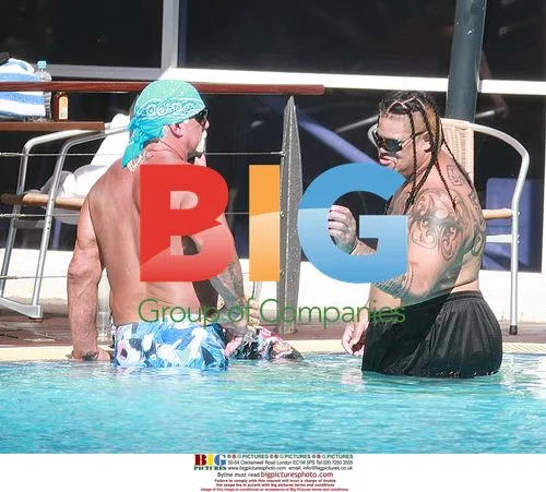 Hulk Hogan Relaxing with Girlfriend and Wrestlers