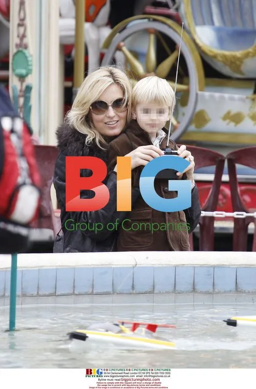 Penny Lancaster and son at Cannes funfair