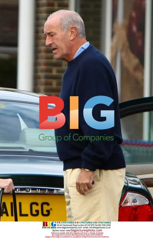 Len Goodman helps elderly lady with shopping