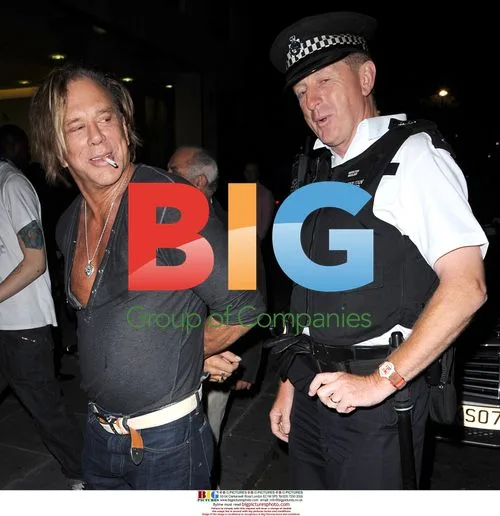 Mickey Rourke Poses with London Policeman