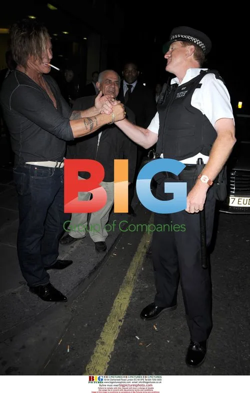 Mickey Rourke Poses with Policeman