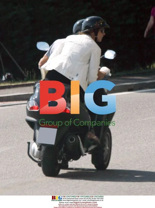 George Clooney on 3-Wheel Scooter with Girlfriend