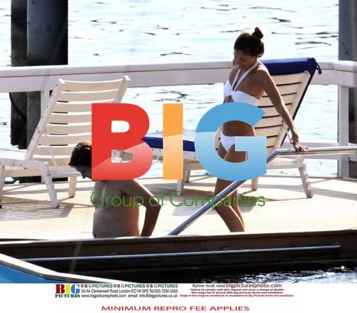 Singer Bryan Ferry and girlfriend relax on vacation