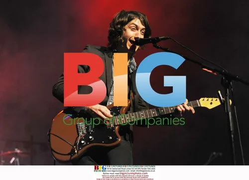 Alex Turner of Arctic Monkeys Performing
