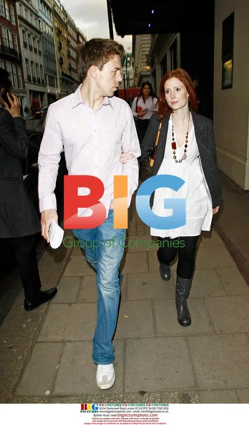 Amy Nuttal and mystery man leaving hotel