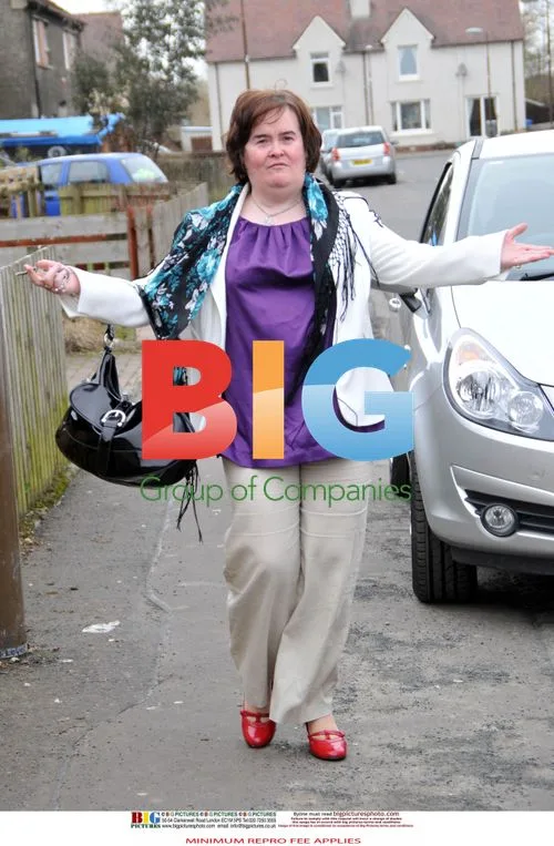 Susan Boyle Poses Outside Home