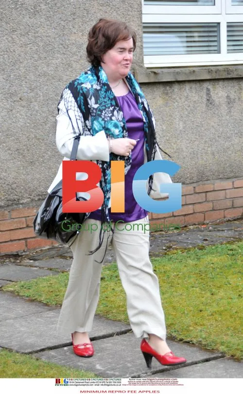 Susan Boyle Poses Outside Home