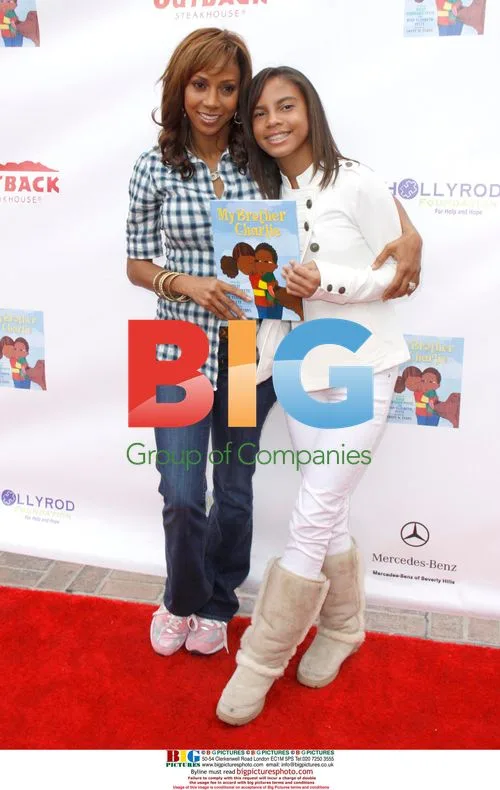 Holly Robinson Peete and daughter at family festival