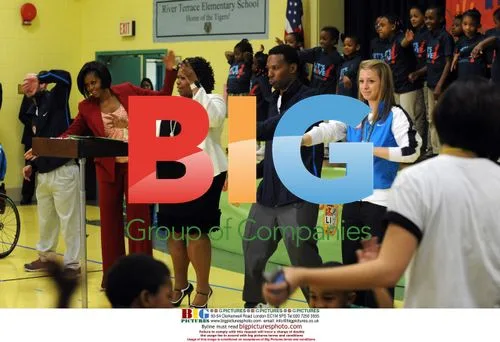 Michelle Obama Exercises with Paralympians