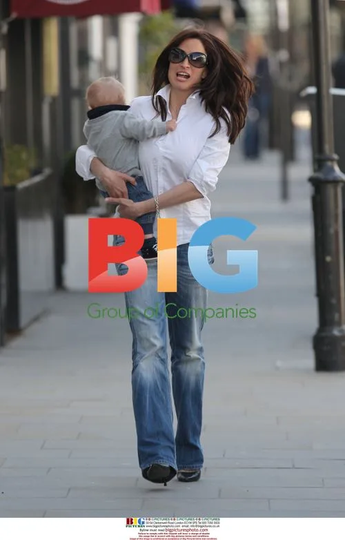 Rebecca Loos with son Magnus in London