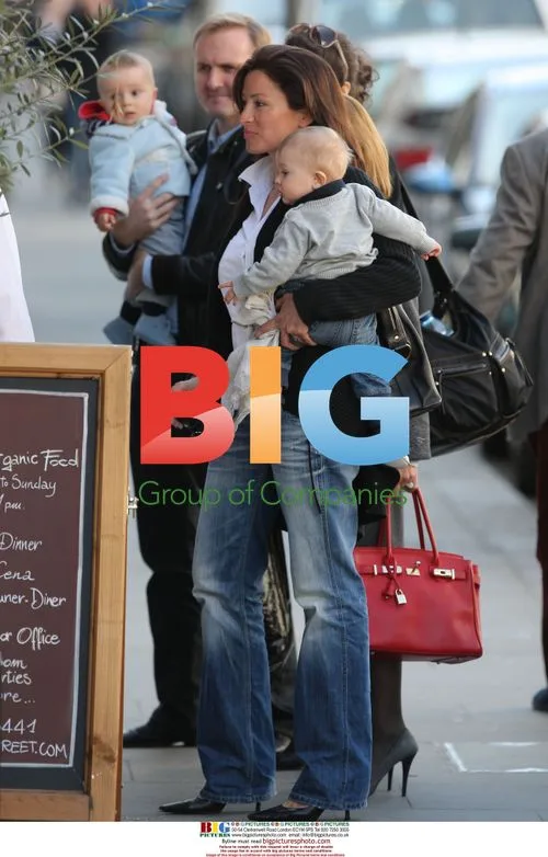 Rebecca Loos with son Magnus in London