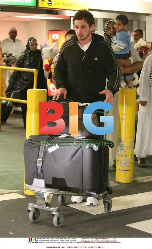 Kelly Brook Arrives at Heathrow with Boyfriend