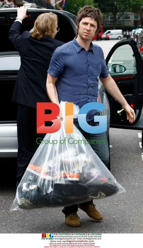 Noel Gallagher Arrives Home With Trainers