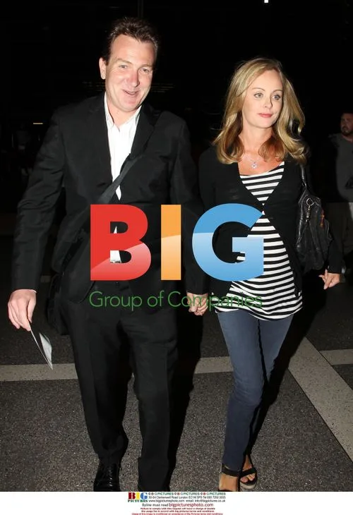 Mark McInnes and pregnant girlfriend arrive at LAX
