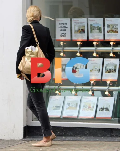 Joely Richardson checks out estate agent window