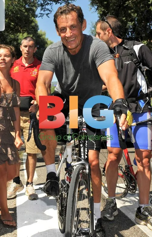 French President Sarkozy Cycles During Vacation