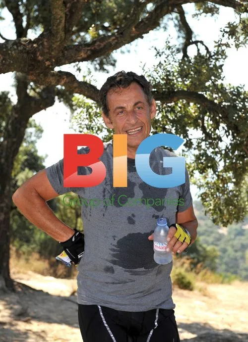 French President Nicolas Sarkozy Cycles on Holiday